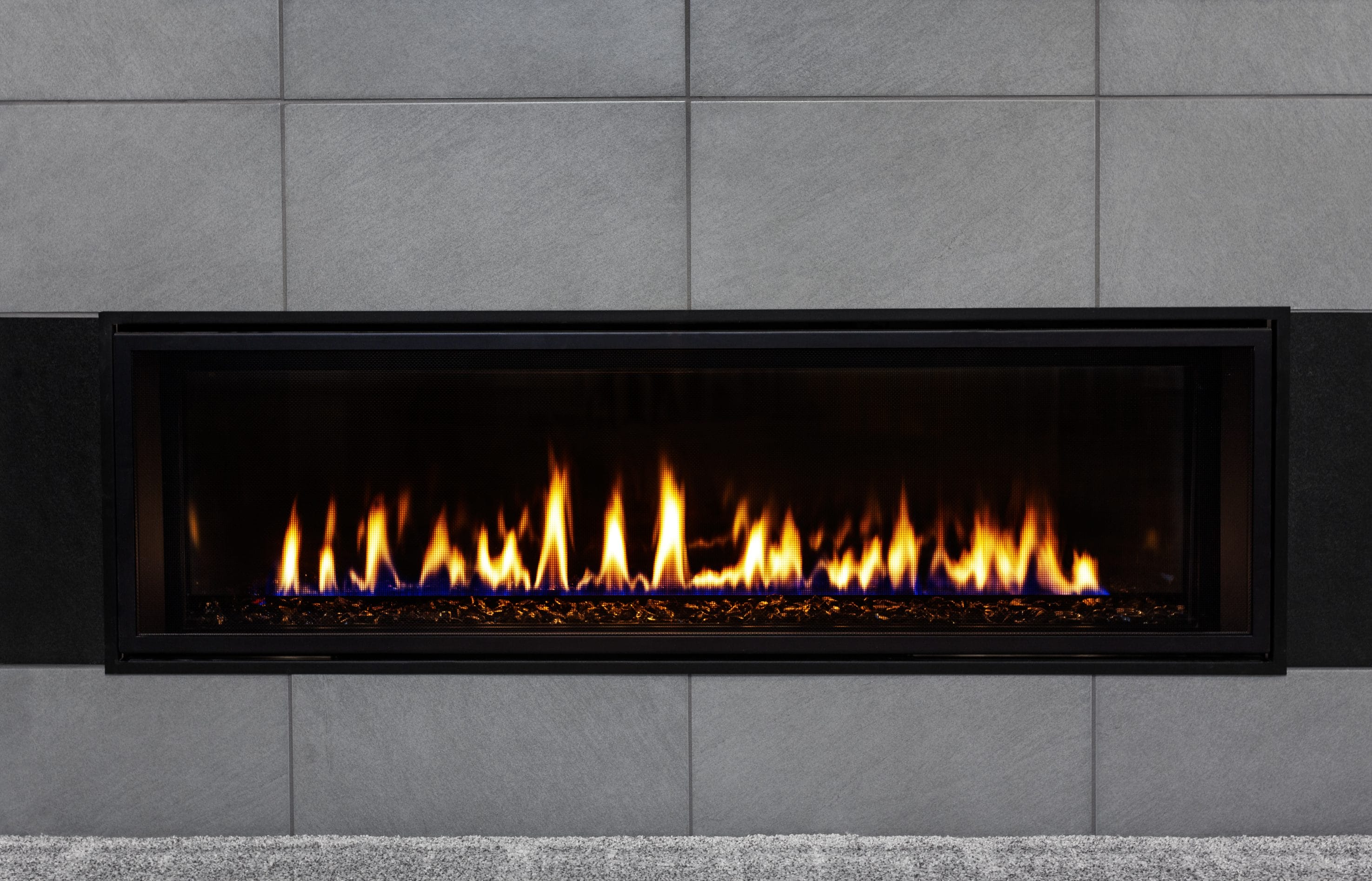 A gas fireplace warming a space.